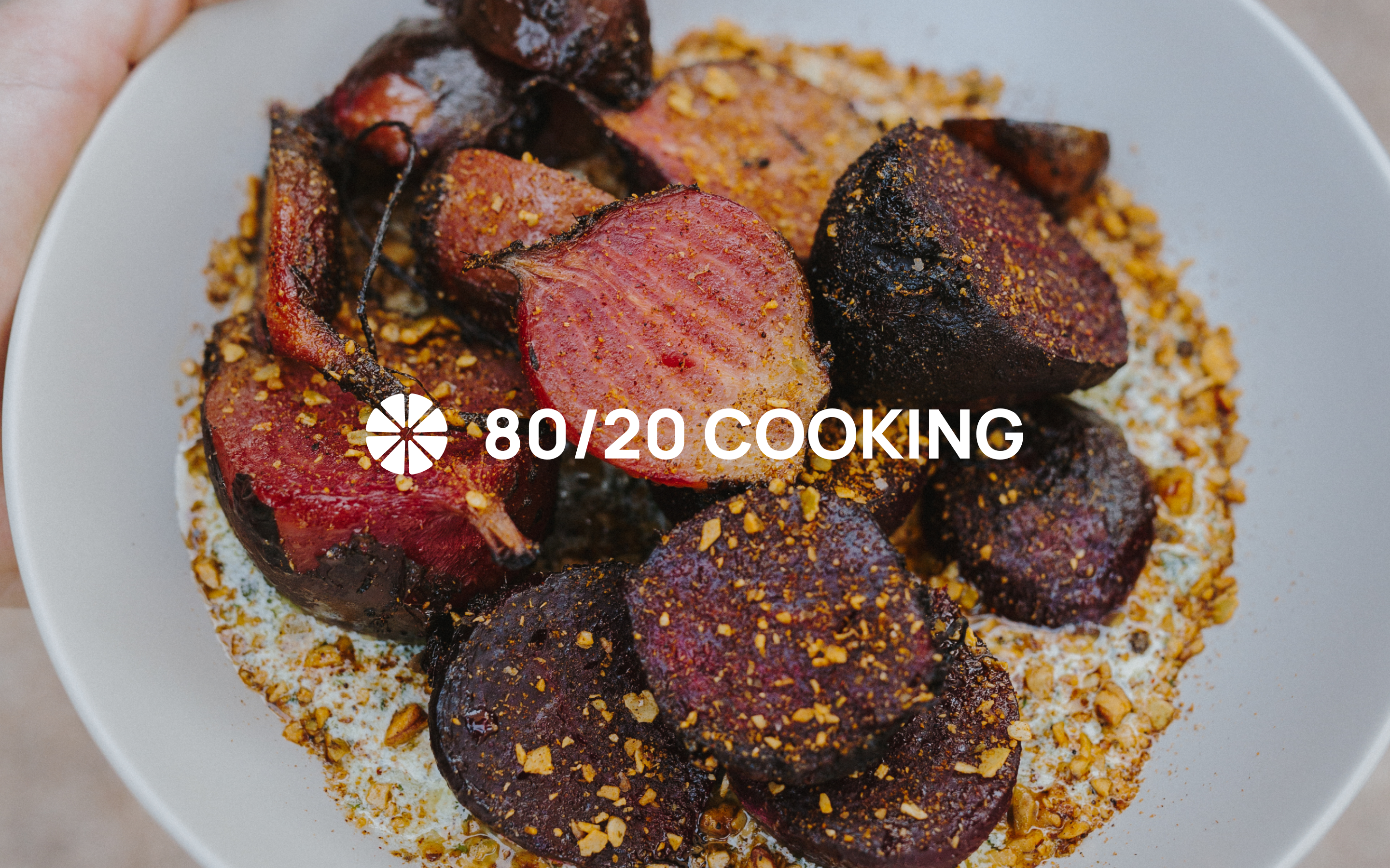 The 80/20 Cooking logo over a beautifully prepared plate of beets.